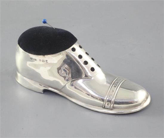 A George V silver mounted novelty boot pin cushion, by S. Blanckensee & Son Ltd, length 12.6cm.